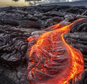 cooling lava flow, glowing red-orange in places
